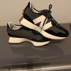 New Balance 327 tennis shoes in black , white and gum . Suede black , rare